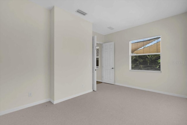 7026 43rd Ave E, Palmetto, FL 34221 - carpeted empty room with baseboards
