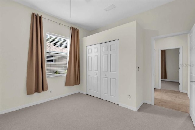7026 43rd Ave E, Palmetto, FL 34221 - unfurnished bedroom with light carpet and a closet