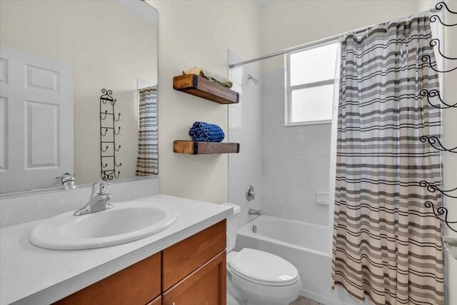 7026 43rd Ave E, Palmetto, FL 34221 - bathroom with vanity and shower / bath combo with shower curtain