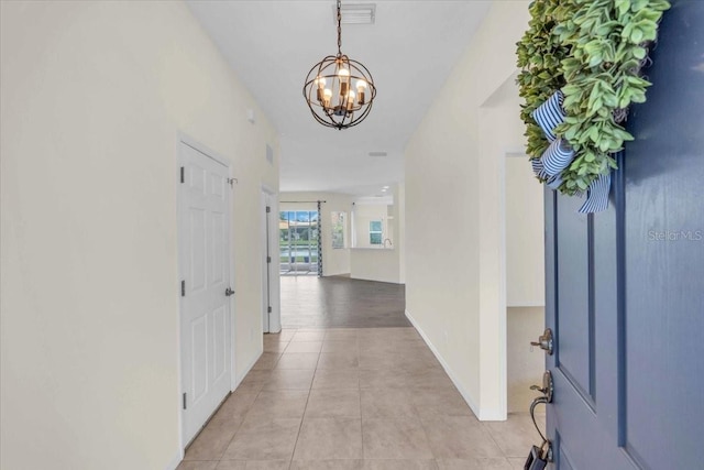 7026 43rd Ave E, Palmetto, FL 34221 - foyer featuring a chandelier and light tile patterned flooring