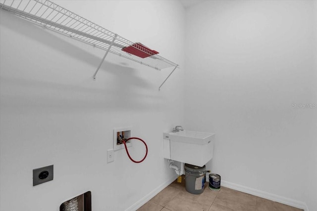 7026 43rd Ave E, Palmetto, FL 34221 - laundry room with hookup for an electric dryer, hookup for a washing machine, and light tile patterned flooring