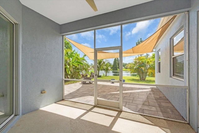 7026 43rd Ave E, Palmetto, FL 34221 - unfurnished sunroom featuring a water view and ceiling fan