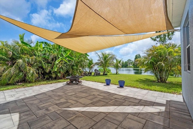 7026 43rd Ave E, Palmetto, FL 34221 - view of patio featuring a water view and a fire pit