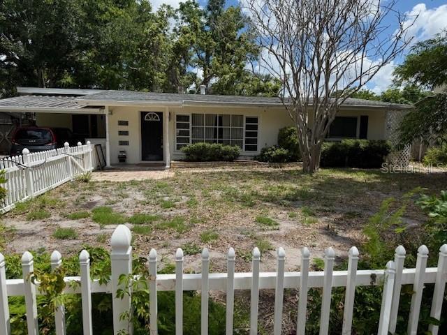 2451 Loma Linda St, Sarasota, FL 34239 - ranch-style home featuring stucco siding