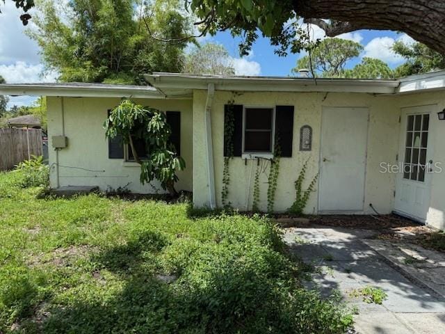 2451 Loma Linda St, Sarasota, FL 34239 - property entrance featuring stucco siding