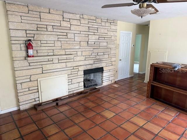 2451 Loma Linda St, Sarasota, FL 34239 - tiled living area featuring a ceiling fan and a fireplace