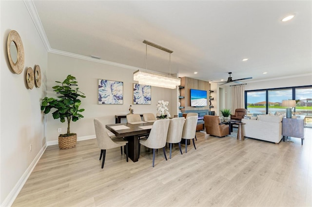 4915 Kiva Cir, Bradenton, FL 34211 - dining space with crown molding, light wood-style floors, a ceiling fan, and recessed lighting