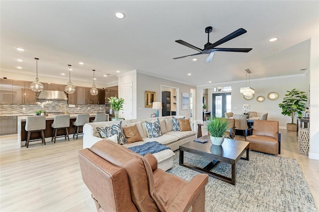 4915 Kiva Cir, Bradenton, FL 34211 - living area with light wood-style flooring, recessed lighting, ornamental molding, and a ceiling fan