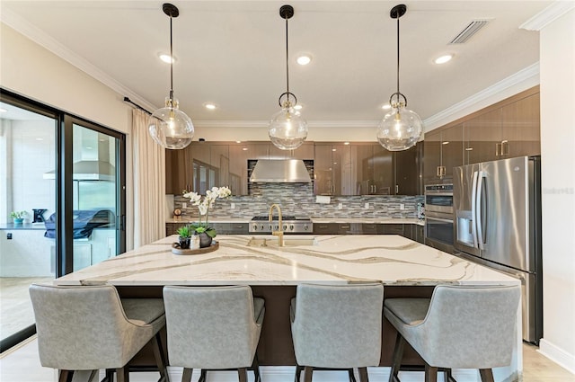 4915 Kiva Cir, Bradenton, FL 34211 - kitchen featuring stainless steel appliances, exhaust hood, tasteful backsplash, ornamental molding, and modern cabinets
