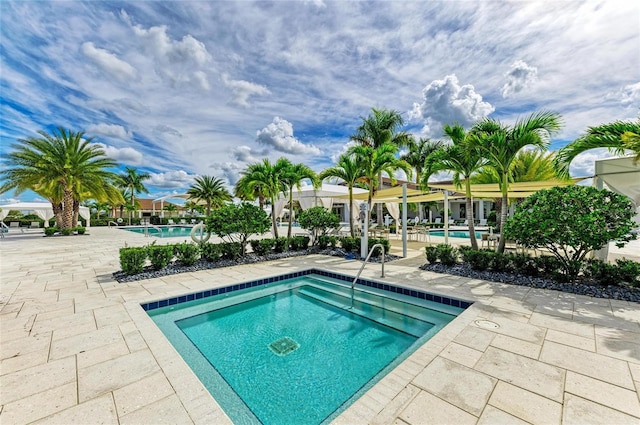 4915 Kiva Cir, Bradenton, FL 34211 - community pool featuring a patio and a community hot tub