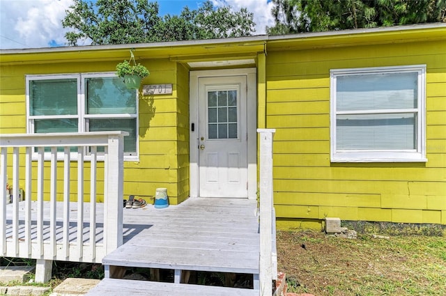 1701 13th St W, Bradenton, FL 34205 - doorway to property with a deck