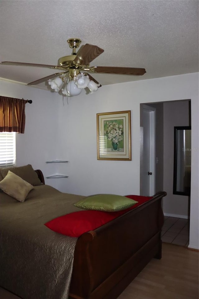 3683 Brown, Arcadia, FL 34266 - bedroom with a ceiling fan, wood finished floors, and a textured ceiling