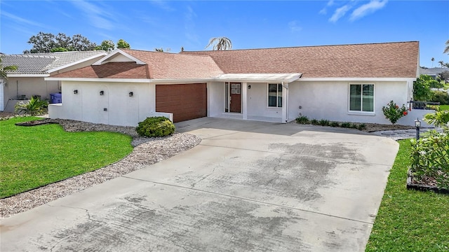 6341 Cocoa Ln, Apollo Beach, FL 33572 - single story home featuring concrete driveway, stucco siding, a front lawn, a garage, and a shingled roof