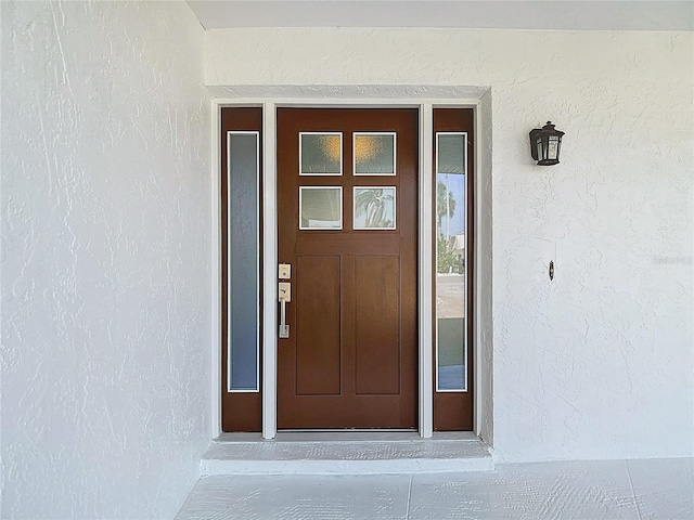 6341 Cocoa Ln, Apollo Beach, FL 33572 - property entrance featuring stucco siding