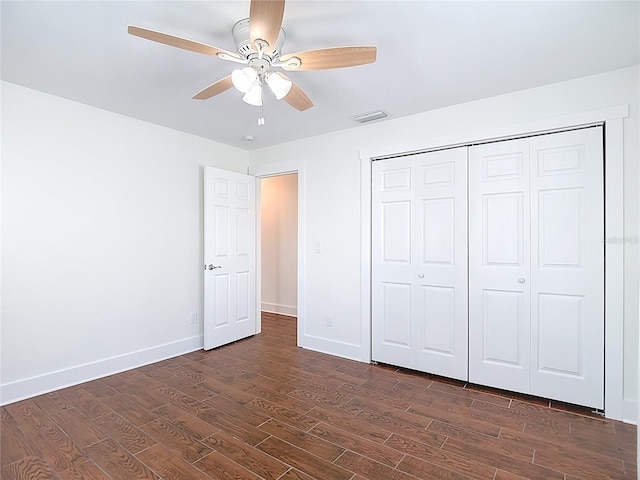 6341 Cocoa Ln, Apollo Beach, FL 33572 - unfurnished bedroom with dark wood-type flooring, a closet, and a ceiling fan