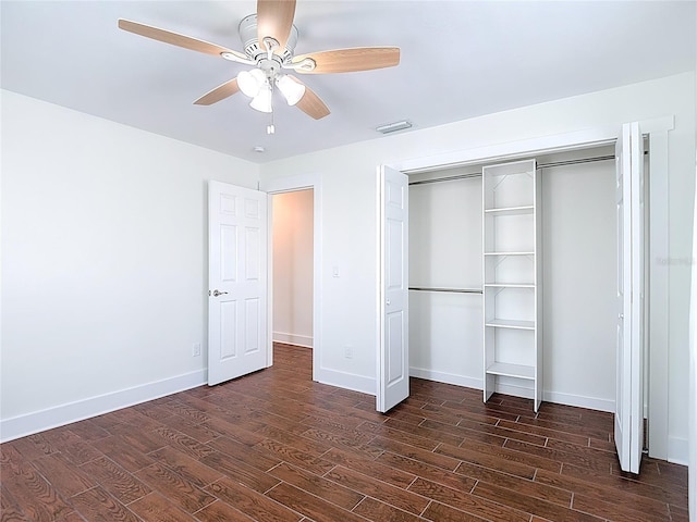 6341 Cocoa Ln, Apollo Beach, FL 33572 - unfurnished bedroom with dark wood-type flooring, a closet, and ceiling fan
