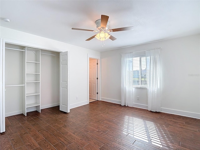 6341 Cocoa Ln, Apollo Beach, FL 33572 - unfurnished bedroom featuring dark wood-style floors, ceiling fan, and a closet