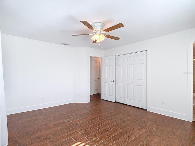6341 Cocoa Ln, Apollo Beach, FL 33572 - unfurnished bedroom with dark wood-type flooring, a closet, ceiling fan, and ensuite bath