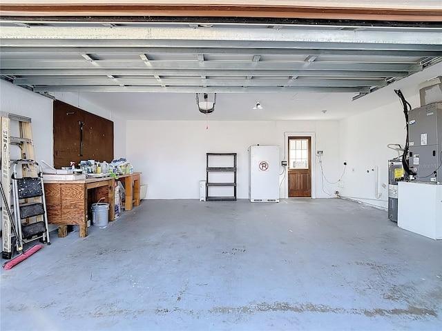6341 Cocoa Ln, Apollo Beach, FL 33572 - garage with electric water heater and refrigerator