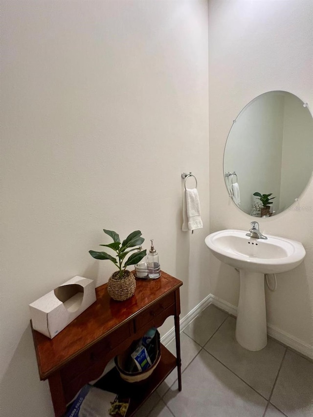 8995 Milestone Dr, Sarasota, FL 34238 - bathroom with tile patterned flooring and baseboards