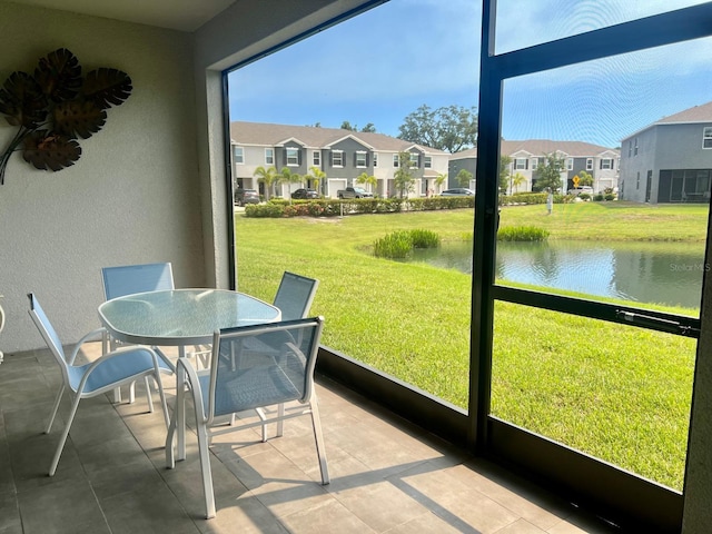 8995 Milestone Dr, Sarasota, FL 34238 - sunroom / solarium with a residential view, a water view, and outdoor dining area