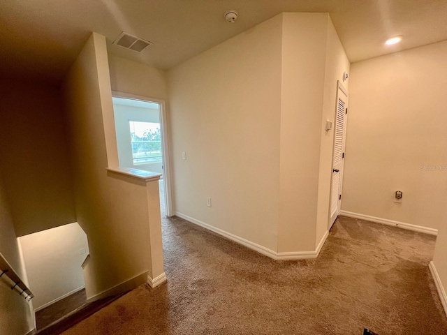8995 Milestone Dr, Sarasota, FL 34238 - hallway featuring carpet floors and an upstairs landing