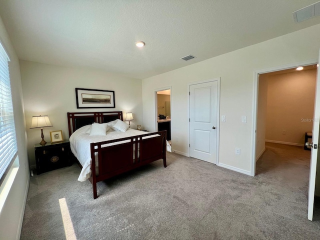 8995 Milestone Dr, Sarasota, FL 34238 - bedroom with carpet floors, recessed lighting, and ensuite bath