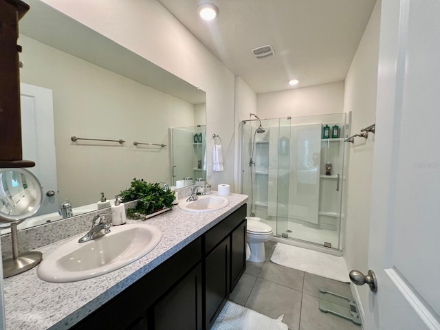 8995 Milestone Dr, Sarasota, FL 34238 - bathroom with a shower stall, double vanity, and tile patterned floors