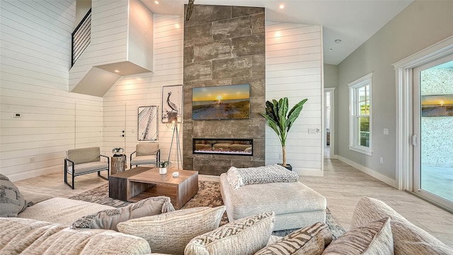 8006 20th Pl W, Bradenton, FL 34209 - living area with a fireplace, high vaulted ceiling, wood finished floors, wood walls, and recessed lighting
