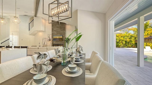 8006 20th Pl W, Bradenton, FL 34209 - dining room featuring a tiled fireplace and a high ceiling