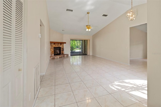 4805 Cypress Lake Ct, Sarasota, FL 34243 - unfurnished living room with lofted ceiling, a ceiling fan, a stone fireplace, light tile patterned floors, and a chandelier