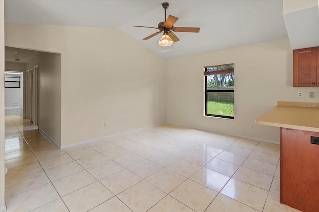 4805 Cypress Lake Ct, Sarasota, FL 34243 - unfurnished dining area with ceiling fan, light tile patterned flooring, and lofted ceiling