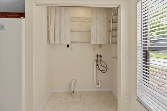 4805 Cypress Lake Ct, Sarasota, FL 34243 - washroom with hookup for an electric dryer, hookup for a washing machine, and light tile patterned flooring