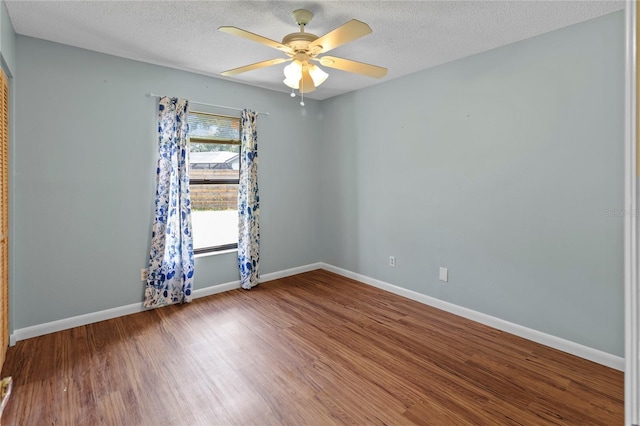 4805 Cypress Lake Ct, Sarasota, FL 34243 - unfurnished room featuring wood finished floors, a ceiling fan, and a textured ceiling