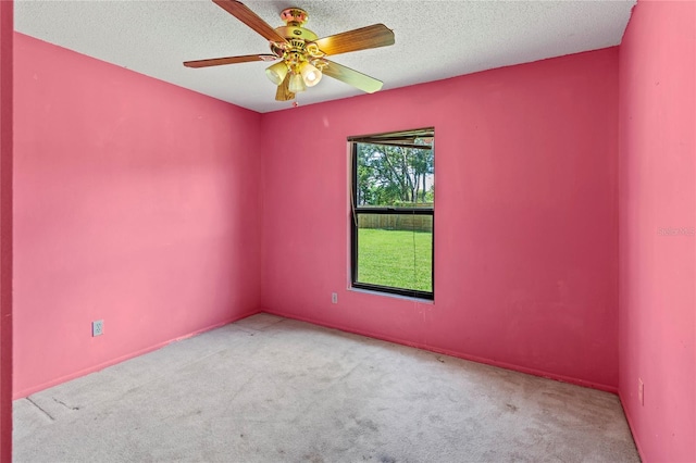 4805 Cypress Lake Ct, Sarasota, FL 34243 - empty room with carpet floors, a ceiling fan, and a textured ceiling