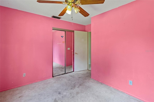 4805 Cypress Lake Ct, Sarasota, FL 34243 - unfurnished bedroom with carpet floors, a ceiling fan, and a closet