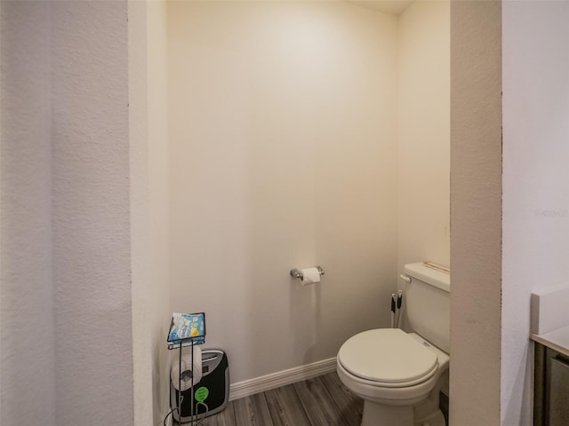 938 Mansfield Rd, Tavares, FL 32778 - bathroom featuring wood finished floors and toilet