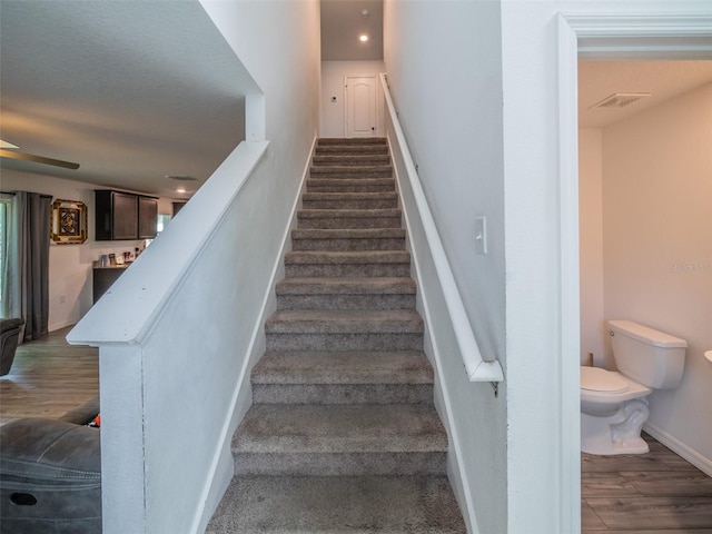 938 Mansfield Rd, Tavares, FL 32778 - staircase with wood finished floors and recessed lighting