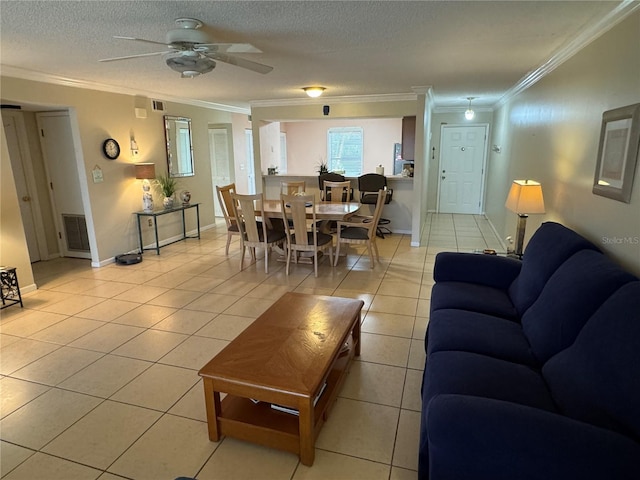 3810 75th St W Unit 137, Bradenton, FL 34209 - living room with ornamental molding, light tile patterned floors, ceiling fan, and a textured ceiling