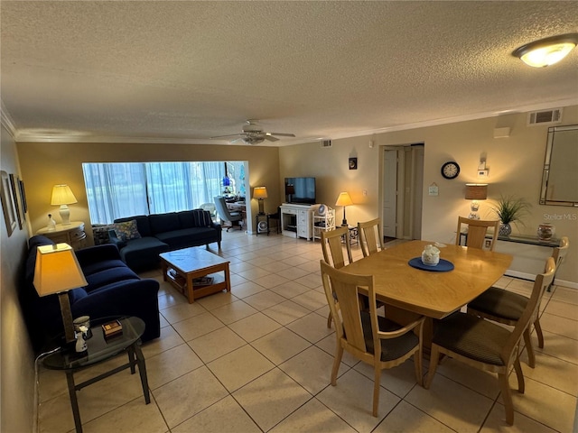 3810 75th St W Unit 137, Bradenton, FL 34209 - dining area featuring ornamental molding, a textured ceiling, light tile patterned floors, and a ceiling fan