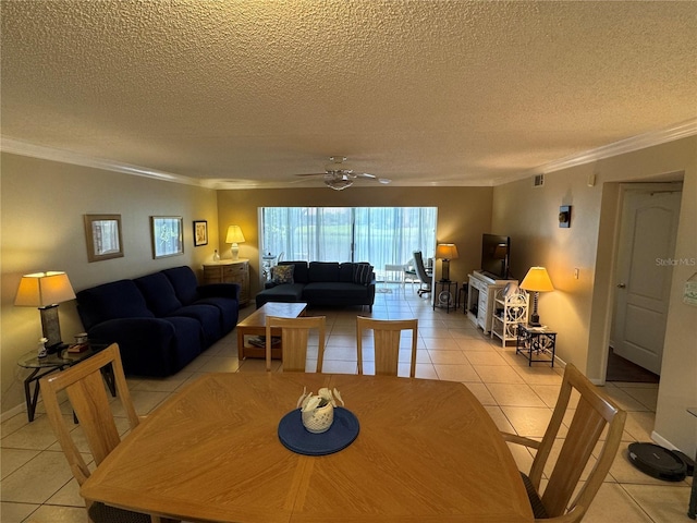 3810 75th St W Unit 137, Bradenton, FL 34209 - dining area with ornamental molding, light tile patterned flooring, a textured ceiling, and ceiling fan