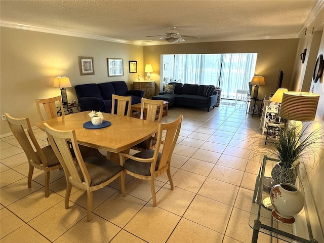 3810 75th St W Unit 137, Bradenton, FL 34209 - dining space with crown molding, light tile patterned floors, ceiling fan, and a textured ceiling
