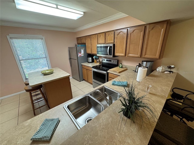 3810 75th St W Unit 137, Bradenton, FL 34209 - kitchen with appliances with stainless steel finishes, crown molding, light tile patterned floors, light countertops, and brown cabinets
