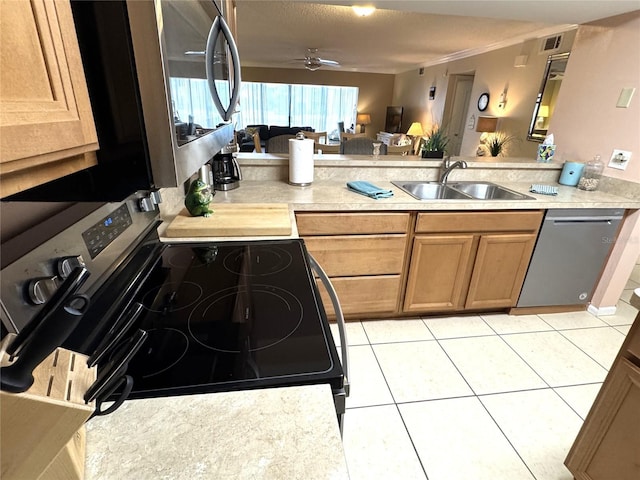 3810 75th St W Unit 137, Bradenton, FL 34209 - kitchen featuring stainless steel appliances, a peninsula, open floor plan, and light countertops