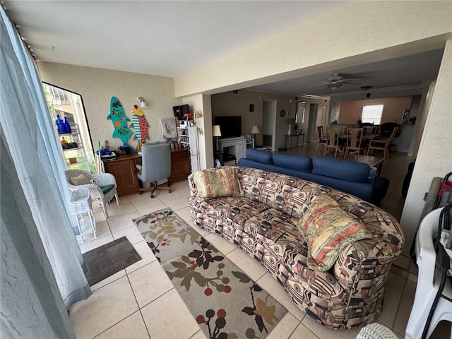 3810 75th St W Unit 137, Bradenton, FL 34209 - living area with a textured wall, light tile patterned flooring, and ceiling fan