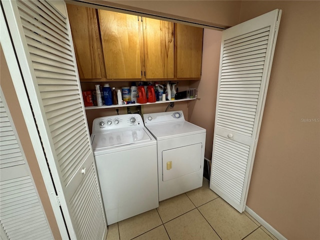 3810 75th St W Unit 137, Bradenton, FL 34209 - laundry area with washing machine and clothes dryer, cabinet space, and light tile patterned floors