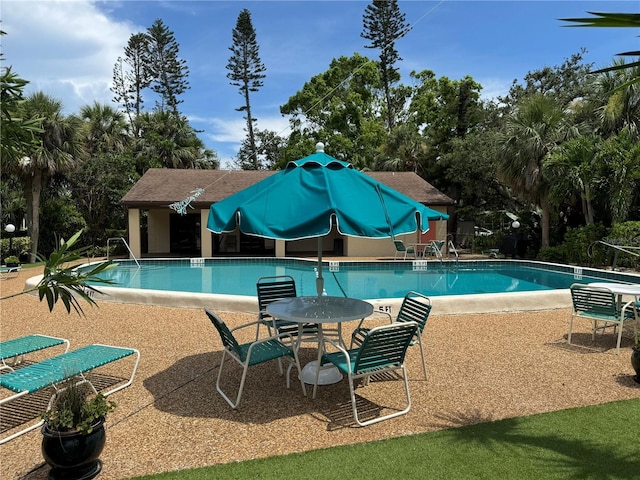 3810 75th St W Unit 137, Bradenton, FL 34209 - community pool with a patio area and view of scattered trees