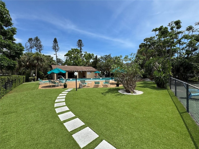 3810 75th St W Unit 137, Bradenton, FL 34209 - fenced backyard with a community pool