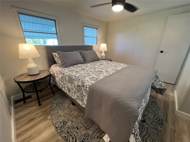 1871 Palm Springs St, Sarasota, FL 34234 - bedroom with light wood finished floors, multiple windows, and a ceiling fan