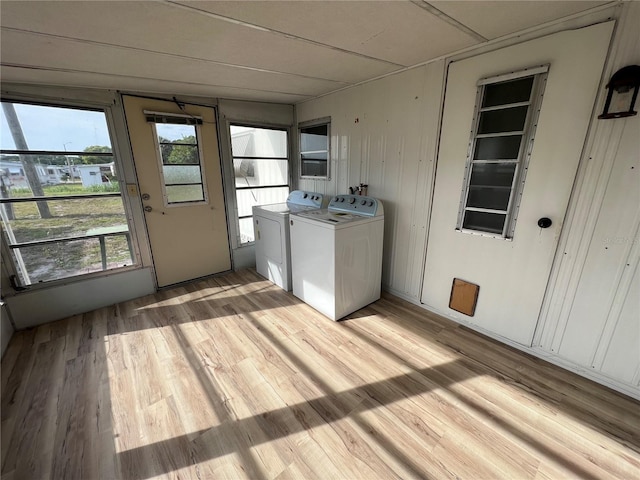 1871 Palm Springs St, Sarasota, FL 34234 - laundry area with washing machine and dryer and light wood-type flooring